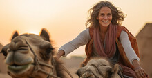 A Mature Woman With Gray Hair Rides A Camel In The Desert.