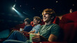 Cheerful young man watching movie at cinema and eating popcorn