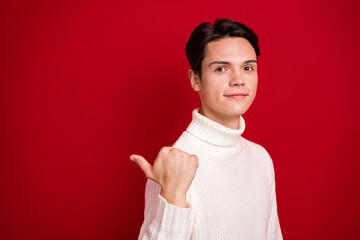 Canvas Print - Closeup photo of calm face handsome man wear white jumper enjoy best offer new year proposition finger direct mockup isolated on red color background