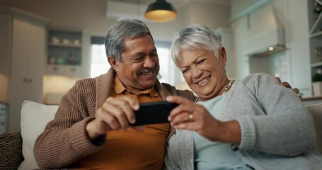 Canvas Print - Senior couple, home and selfie while laughing on sofa and enjoying retirement together. Social media, smile and happy pensioners in house with playful energy as elderly people take profile picture