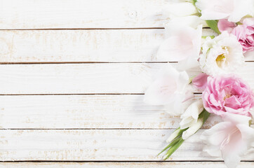 Wall Mural - pink and white flowers on white wooden background