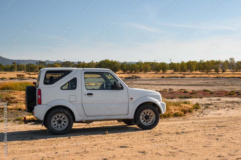 kos-greece-may-8-2023-suzuki-jimny-parked-on-the-gravel-road-kos