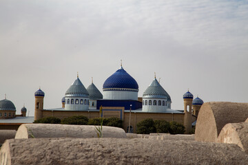 The pointed tip of the beautiful towers has a blue sky color in the middle and four towers around it and three blue towers below it.