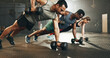 © Felix/peopleimages.com - Gym, group and dumbbell rowing exercise for power, muscle and challenge in workout class. Diversity of strong people, bodybuilding and push up with weights for fitness, healthy training and action
