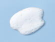 White skincare cleansing foam on light blue background