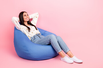 Poster - Full length photo of cute sweet lady wear white cardigan arms behind head looking empty space isolated pink color background