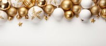 Top View Of White And Golden Christmas Decorations Arranged On A White Background In A Frame
