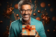 white adult handsome man with glasses holds box with a Christmas gift in hands