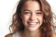 © DenisNata - Portrait of young beautiful cute cheerful teenage girl laughing. Teen girl looking at camera over light gray background.