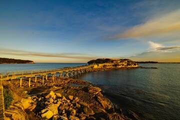 Canvas Print - Scenic view of the bridge to Bear Island in Sydney, Australia at sunset