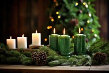 Unlit Candles On A Table With Wreath Of Evergreens