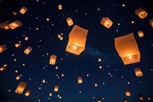 Paper Lanterns Floating In A Night Sky