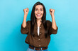 Photo of excited young girl winner celebrating lottery triumphing raise fists open mouth isolated blue color background