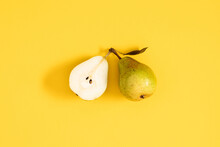 Yellow Pears Pattern. Close Up Of Pear On Yellow Background. Autumn Fruit Concept From Ripe Juicy Pears. Flat Lay, Top View