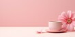 coffee cup with flowers on pink background