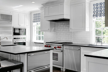 Wall Mural - Luxury White Modern Kitchen Interior with White Cabinets with Gas Stove and Black Stone Counters