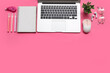 © Pixel-Shot - Laptop, computer mouse and stationery on pink background