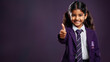 © Cash Cow Concepts - young student in school uniform showing thumbs up