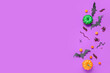 Leinwandbild Motiv Halloween composition with candy bugs and pumpkins on purple background