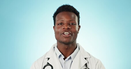 Canvas Print - Doctor, black man and face with wellness advice, healthcare conversation and discussion in studio. Blue background, medical portrait and communication of a professional with talking and employee