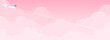 飛行機とピンク色の雲・空　背景素材（バナー向け横長）