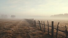 An Old Fence On A Field With Fog