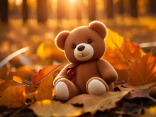 A Cute Teddy Bear Sitting Among Autumn Leaves.