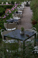 Wall Mural - chairs and tables in a garden