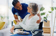 © Wesley JvR/peopleimages.com - Black man, caregiver or old woman in wheelchair talking or speaking in homecare rehabilitation together. Medical healthcare advice or male nurse nursing or helping elderly patient with disability