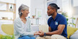 © Wesley JvR/peopleimages.com - Black man, caregiver or old woman holding hands for support consoling or empathy in therapy. Medical healthcare advice, senior person or male nurse nursing, talking or helping elderly patient.