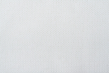 Sweater or scarf fabric texture large knitting. Knitted jersey background with a relief pattern. Wool hand- machine, handmade.