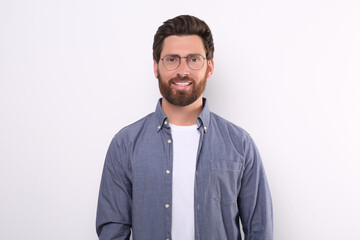 Wall Mural - Portrait of handsome man in glasses on white background