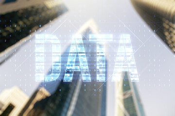 Wall Mural - data word hologram on blurry cityscape background, big data and blockchain concept. multiexposure