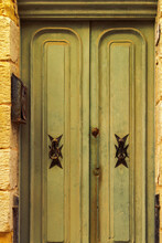 Traditional Brass Door Knockers With Maltese Cross Design Outside A Building In The Alleys Of The Old City Of Birgu (Citta Vittoriosa), Malta, Mediterranean