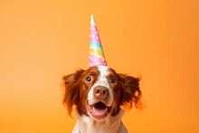 Close-up Portrait Photography Of A Funny Brittany Dog Wearing A Unicorn Horn Against A Pastel Orange Background. With Generative AI Technology