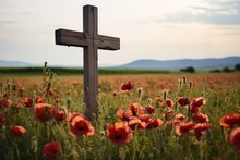 A Wooden Cross In A Field Of Poppies