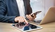 © Munwar - Businessman using tablet. Generative AI.