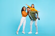 © Prostock-studio - Cheerful european family of three having fun, dad piggybacking daughter over blue background, full length, free space