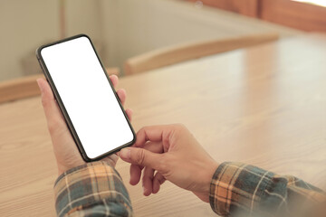 Wall Mural - cell phone blank white screen mockup.hand holding texting using mobile on desk at office.background empty space for advertise.work people contact marketing business,technology