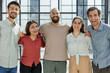 © Katsiaryna - Portrait of happy excited business partners colleagues of different looking at camera and embracing