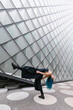 © VISTA by Westend61 - Flexible young dancer bending over backwards in front of modern building