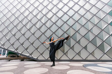 Young Dancer Dancing In Front Of Modern Building