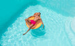 © VISTA by Westend61 - Young man relaxing on inflatable float in pool