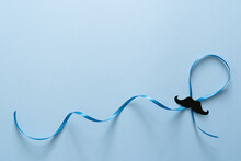 Movember Concept - Event To Raise Awareness Of Men's Health Issues, Moustache Anf Blue Ribbon