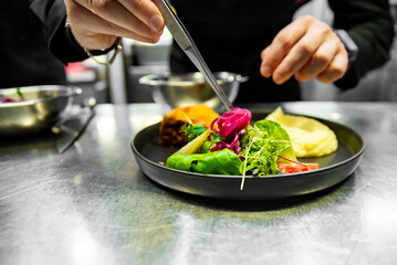 Sticker - chef hand preparing Meat Pie with mashed potato and salad on restaurant kitchen