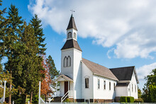 Church In Rural British Columbia Canada. An Old Country Church On A Sunny Day With Blue Sky At The Background