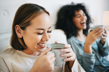 Canvas Print - Coffee, smile and lesbian couple on bed in conversation for bonding and relaxing together. Happy, rest and interracial lgbtq women laughing, talking and drinking latte in bedroom of modern apartment.