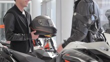 Seller Gives Motorbike Helmet To The Buyer
