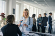 © Johnér - Woman picking up her pass before conference