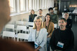 © Johnér - Group of business people attending presentation during conference
